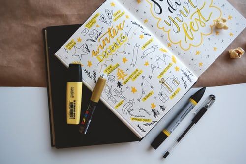bullet journal with pens